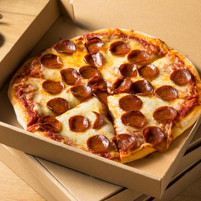 pepperoni pizza in a take out box